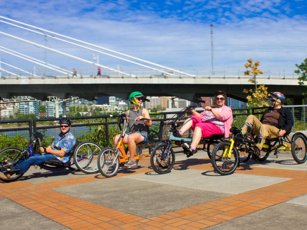 Adaptive cycles for rent in Portland, including hand cycle, tricycle, recumbent bikes.